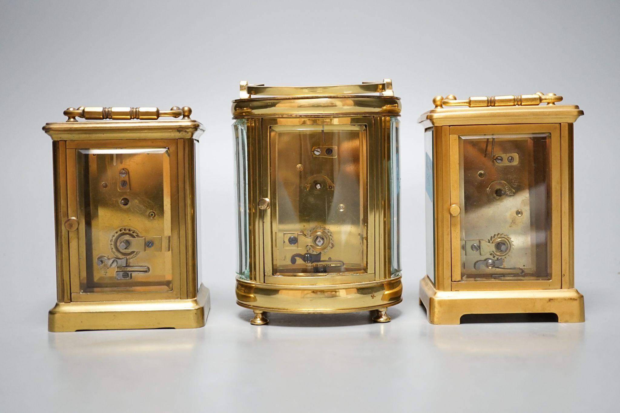 Three carriage timepieces, tallest 12 cm